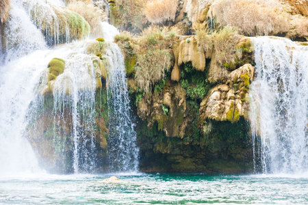 Krka, Sibenik, Croatia, Europe - Overhang under a waterfall within Krka National Parkの写真素材
