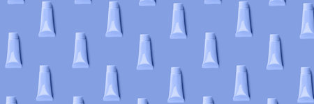 Blank tube layout on blue background. Cosmetic product. Skin care. Female hygiene. Banner. Pattern.の写真素材