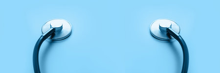 Medical stethoscope for the heart on blue background. Medicine and healthcare. Banner.の写真素材