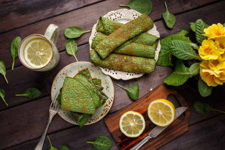 pancakes with spinach on wood table. Top view. Lay flat.の写真素材