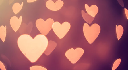 Heart shaped bokeh lights. Soft abstract background with love theme.の素材