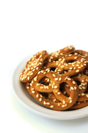 Pretzels with sesame seeds on a plateの写真素材