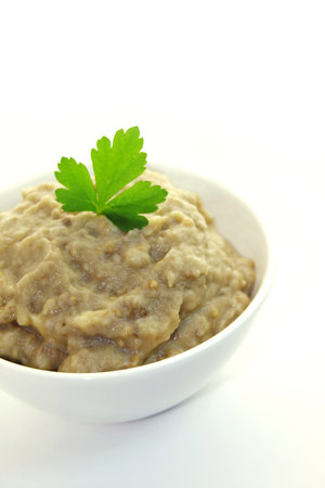Aubergine paste in a bowl isolated on white backgroundの写真素材