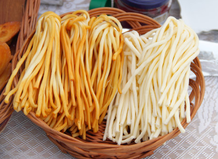 Traditional Polish smoked cheese in a basketの写真素材