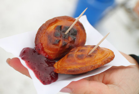 Traditional Polish smoked cheese - oscypek- in a handの写真素材
