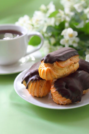 Eclairs with cream in chocolate coatingの写真素材