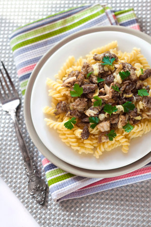 Spiral pasta with morel mushroomsの写真素材