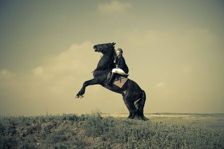 horsewoman trains the horse / split vintage tonedの写真素材