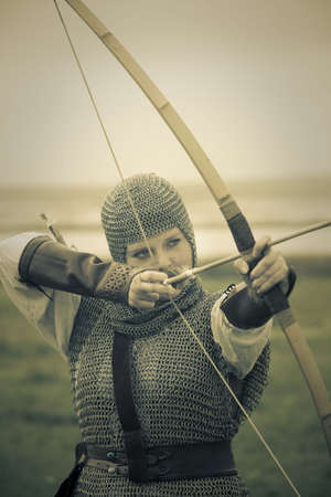 bows woman / medieval armor / historical story  / retro split tonedの写真素材