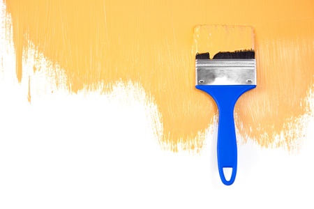 Orange  painted shape with brush / white background / copy spaceの写真素材