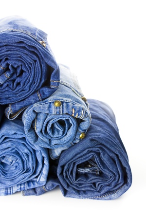 Rolls of Blue Jeans isolated on white background with copy space for your textの写真素材