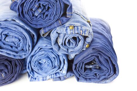 Rolls of Blue Jeans isolated on white background with copy space for your textの写真素材