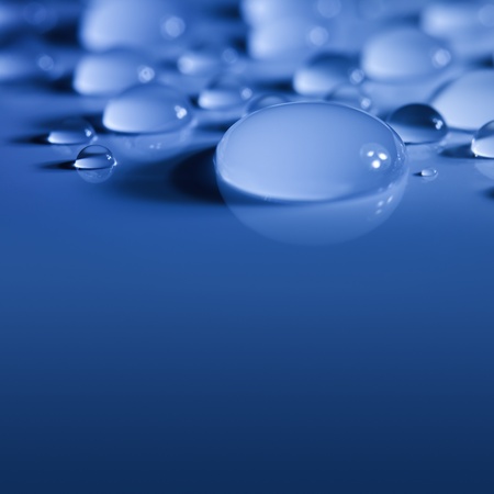 Blue Big Water Drops Background with Beautiful Light and Shadows     focus on the centerの写真素材