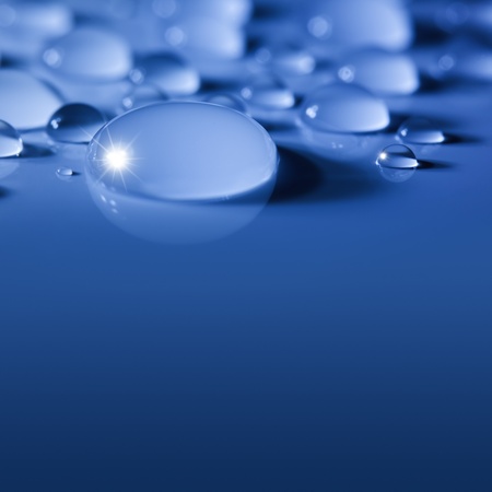 Blue Big Water Drops Background with Sparks  /  focus on the centerの写真素材