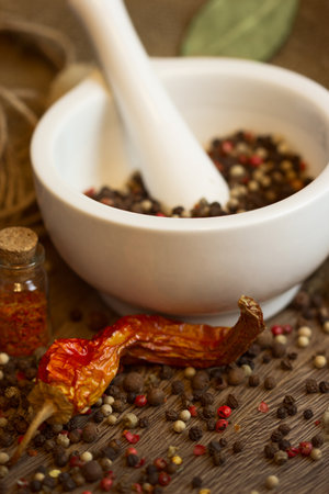 White mortar   pestle with dried pepper and chiliの写真素材