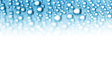 Abstract Border of Blue Water Drops - soft focus on the center, copy space for textの写真素材