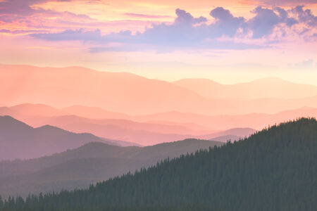 Beautiful Mountains -  sunset time. Hight peaks, clouds and colorful sunsetの写真素材