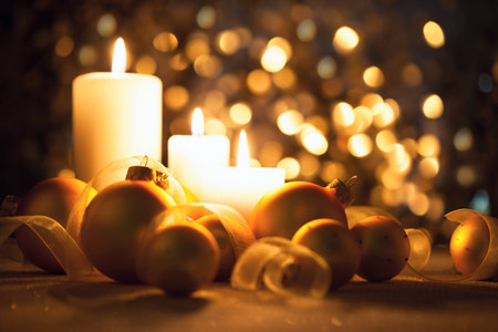 Warm Night Christmas decorations  with candles, baubles and ribbons on magic  bokeh backgroundの写真素材