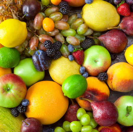 Background of different  Fruits with water drops - fresh and organicの写真素材