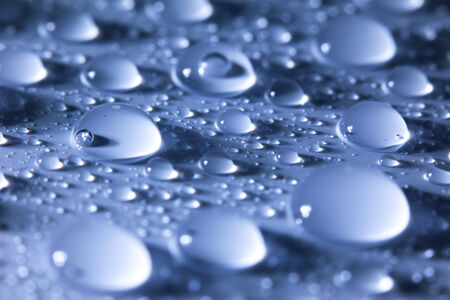 Water droplets  blue abstract background -- super macro shotの写真素材