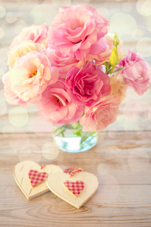 Love Vintage Background - Beautiful Eustoma  Flowers and Two Hearts, light defocusedの写真素材