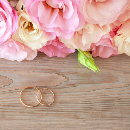 Gentle Vintage Wedding  Background with gold Rings and beautiful flowersの写真素材