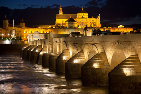 Mosque (Mezquita) and  Roman Bridge with illuminations at night sky , Cordoba, Andalusia, Spain, Europeの写真素材