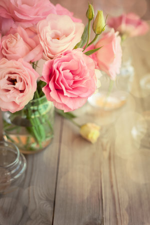 Bright romantic background with roses and bokeh, copy space for text