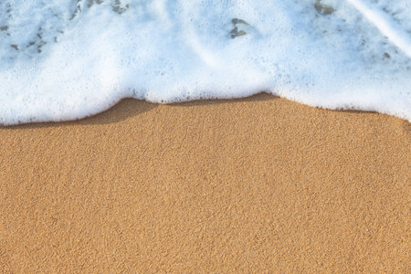 Soft wave of the sea on the sandy beach - summer backgroundの写真素材