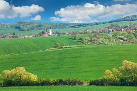 Little town on the hills, blue sky, beautiful buildings and nature, traditional architecture, summer vacation concept, Europe, Czech Republicの写真素材
