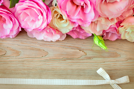 Flowers border and  retro ribbon  on the wooden surface, vintage styleの写真素材
