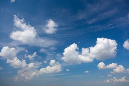 Light Blue Summer Sky with Beautiful White Clouds, natural background wallpaperの写真素材