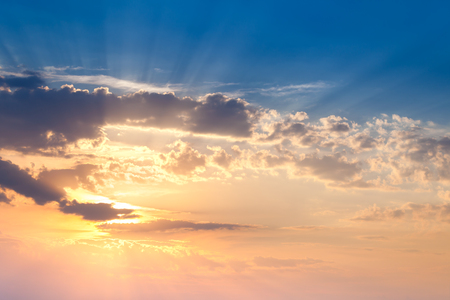 Amazing Sundown Sky with Real Golden Sunbeams, natural colorful background for wallpaperの写真素材