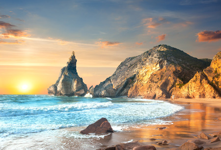 Ocean Landscape at Sundown, big rocks and stones beach. Portugal, Europeの写真素材