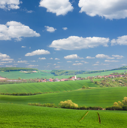 Panorama of  Little town on the green hills, blue sky, beautiful buildings and nature, traditional architecture, summer vacation concept, Europe, Czech Republicの写真素材