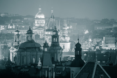 Beautiful Night View of Prague famous roofs silhouettes - black and whiteの写真素材
