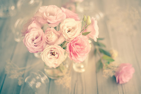 Gentle Vintage Bouquet of beautiful pink flowers on old wooden texture - still lifeの写真素材