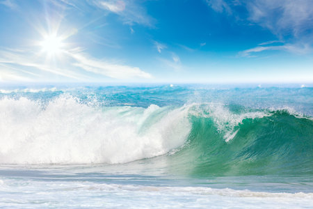 Summer vacation on the Sea - seascape with beautiful wave and blue sky with sunの写真素材