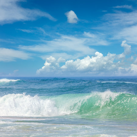 Beautiful Waves in the warm Sea Water and blue sky with light clouds, relax in the Summer Timeの写真素材