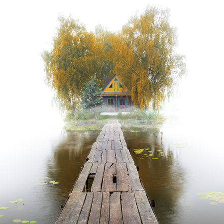 Old wooden house on the lake, foggy autumn morning, quiet moodの写真素材
