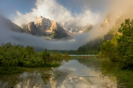 Wild Mountains Lake at the misty morning. Nature Landscape. Lago di Landro Durrensee, Dolomites, Alps, Italy, Europe.の写真素材