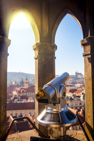 Touristic binocular in Prague, European travel - beautiful sunny day for walking and sightseeing. Famous landmark defocused, soft focus on the foregroundの写真素材