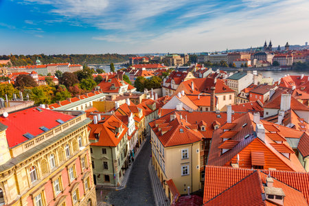 Panoramic Aerial view of old narrow streets in Prague city with red rooftops, downtown, beautiful old city center, Czech Republic, European travelの写真素材