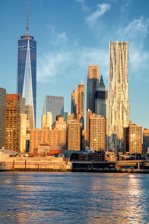 Office Buildings in Manhattan from river, famous landmark of New York, morning colors and light, New York City, USAの写真素材