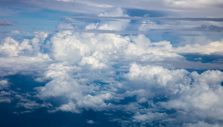 Beautiful, dramatic clouds and sky atmosphere viewed from the plane. High resolution and qualityの写真素材