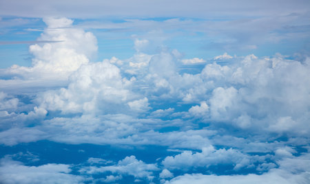 Sky background - Aerial view of  light clouds and sky atmosphere viewed from the planeの写真素材