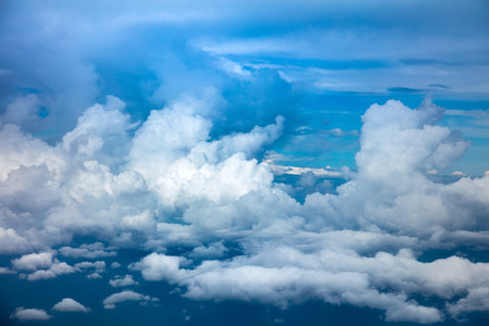 Sky background - Aerial view of  dramatic clouds and sky atmosphere viewed from the planeの写真素材