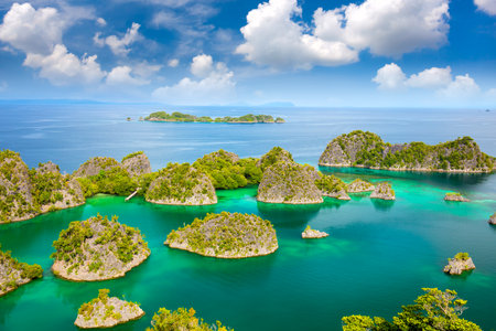 Aerial view of paradise islands in turquoise sea with reef islands coastline, beautiful lagoons. Indonesiaの写真素材