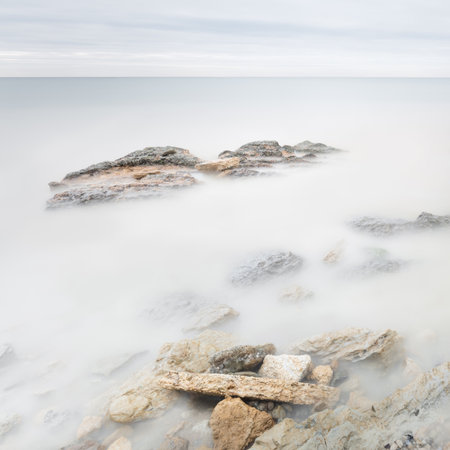 Long exposure sea artistic landscape. Light, water and stones perspectiveの写真素材