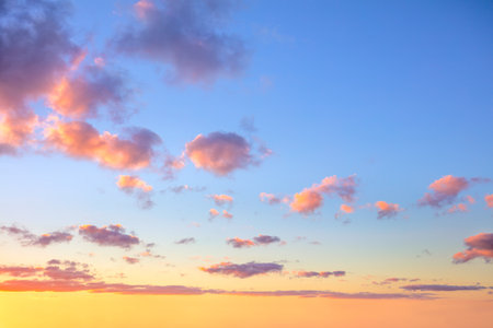Gentle ligth colors of sunrise sundown sky with colorful small clouds, hi resolutionsの写真素材